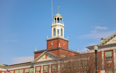 historical church landmark with ancient architectural tower with european style medieval design downtown area symbolizing religion and christianity 