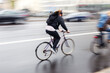 © Christian Müller - man on a bicycle on the move on a rainy street in the city