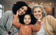© Allistair/peopleimages.com - Love, family and portrait by girl with mother and grandmother on a sofa, happy and smile in their home. Bond, relax and face of senior woman with adult daughter and grandchild on couch on the weekend