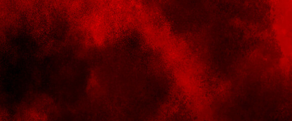 red powder explosion cloud on black background. freeze motion of red color dust particles splashing.