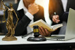 © maeching - judge on wooden table And experienced lawyers meet with clients and give advice behind the scenes. legal services legal consulting concept