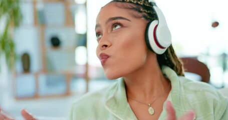 Music, dance and happy woman with headphones in a living room, smile and celebrating freedom on blurred background. Dancing, celebration and girl excited for radio, podcast or online audio track