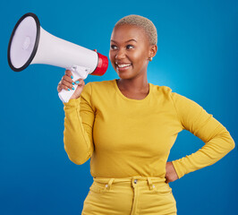 Wall Mural - Black woman, megaphone and smile, protest and voice, freedom of speech and activism on blue background. Happy female, broadcast and speak out, rally and activist, loudspeaker with opinion in studio
