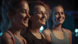 © Demencial Studies - Fun in fitness clothing: Three female friends laughing happily in a sports studio
