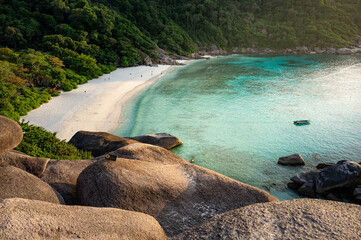 Wall Mural - Beautiful white sand beach at Donald Duck Bay or Ao Kuerk Bay during sunset, view from Sailboat rock viewpoint at Similan island number 8, Similan National Park, Phang-nga Province, Thailand.