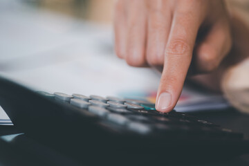 Aufkleber - Businessman use calculator to calculate documents, profit and loss statement review concept of company performance, effective tax deduction planning for individuals and companies paying tax rates.