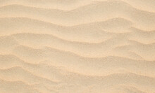 Abstract Background Of Sandy Sea On The Beach. Wave Sand Texture