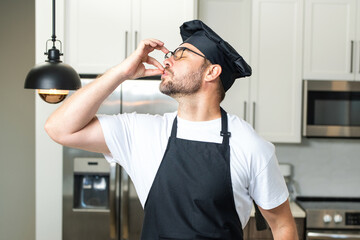 Man chef cooker, baker. Male chefs with sign of perfect food. Chef cooking, showing sign for delicious. Chef, cook making tasty delicious gesture by kissing fingers. Chefs cook in hat and apron kiss.