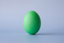Colored Green Easter Egg On A Light Blue Background