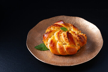 Wall Mural - Food concept Homemade inside out hong kong coconut bun on black background with copy space