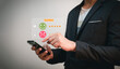 © Patiwat - customer evaluation and survey, businessman using phone tick on smile face because he is satisfied with excellent service and performance