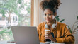 © makibestphoto - Using laptop pc, Young african american university foreign exchange students study online on laptop pc english language class by international specialists with master at cafe.