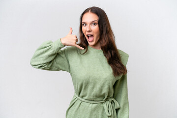 Wall Mural - Young caucasian woman isolated on white background making phone gesture. Call me back sign