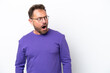 © luismolinero - Middle age caucasian man isolated on white background doing surprise gesture while looking to the side