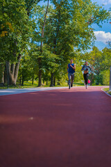 Wall Mural - Young couple running