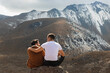 © ADDICTIVE STOCK - Loving couple in front of mountains