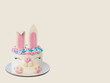 © larry140585 - White and pink cake with cute bunny for children's birthday or Easter. Bunny made of fondant and buttercream. Beige background. Horizontal orientation