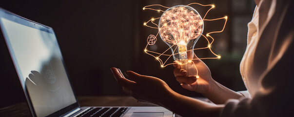 Poster - a person holding a light bulb with a shape of human brain inside in front of a laptop. creative idea