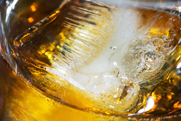 Wall Mural - Closeup of photo of whiskey glass with ice.