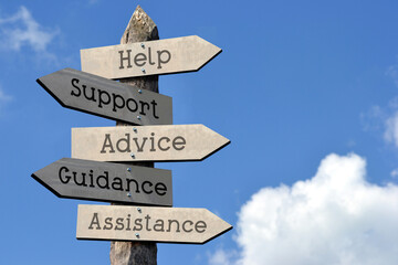 Wall Mural - Help, support, advice, guidance, assistance - wooden signpost with five arrows, sky with clouds