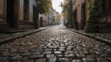 Fototapeta Uliczki - A high - resolution image of an old cobblestone street, showcasing the uneven stones and moss growth between the cracks, perfect for historical or European settings