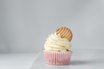 Sticker - Pink cupcakes with tall american buttercream swirl and cookie garnish, cupcakes in pink liners with a tall vanilla buttercream and a cookie, birthday cupcakes on a white background