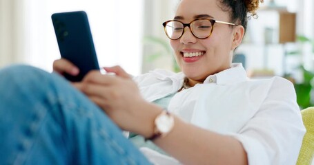 Canvas Print - Happy woman relax on sofa and phone for internet, social media post or texting on mobile app at home. Young biracial person on couch or lounge scroll and typing on a cellphone, smartphone or web chat