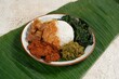 Nasi Padang with rendang is an Indonesian food from West Sumatra in Indonesia. Nasi Padang as favorites food for Indonesian people.