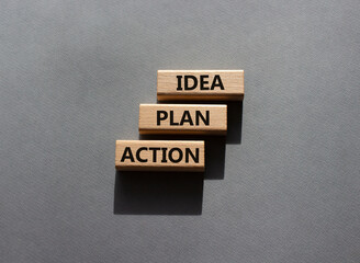 Wall Mural - Idea Plan Action symbol. Wooden blocks with words Idea Plan Action. Beautiful grey background. Business and Idea Plan Action concept. Copy space.