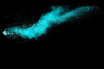 Wall Mural - splash of green colored powder on black background.green powder explosion.
