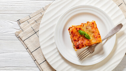 Canvas Print - portion of Lasagna on white plate, top view