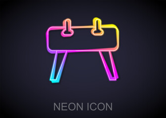 Poster - Glowing neon line Pommel horse icon isolated on black background. Sports equipment for jumping and gymnastics. Vector