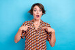 Photo of sweet impressed woman wear print blouse pointing fingers herself isolated blue color background
