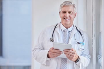 Poster - Portrait, man and doctor with tablet, healthcare and career with success, connection and research in hospital. Face, mature male and medical professional with technology, online reading and diagnosis