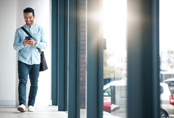 Poster - Professional man with phone, communication with typing or scroll through social media with smile. Happy young male, reading text and contact with network, technology and creative employee at startup
