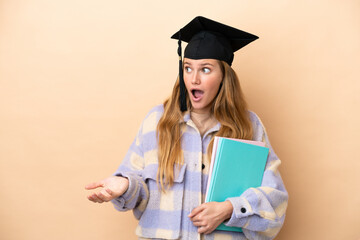 Wall Mural - Young student woman over isolated background with surprise expression while looking side