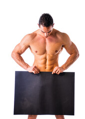 naked young male bodybuilder holding blank black sign