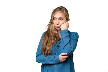 Wall Mural - Young blonde woman over isolated background with tired and bored expression