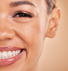 Wall Mural - Happy, portrait and closeup of woman in studio for makeup, cosmetic and skincare on brown background. Smile, face and zoom on girl excited for beauty, treatment or dermatology, smiling and isolated