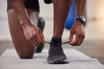  Lace shoes, man and gym for workout, training and start bodybuilding performance. Closeup sports guy tie sneakers for exercise, healthy fitness and runner footwear on floor, power and athlete action