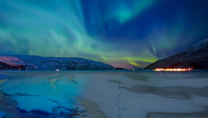 Wall Mural - northern lights or aurora borealis in the sky over tromso, norway