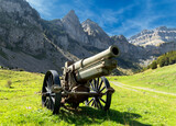 Fototapeta Londyn - View of an old artillery piece (cannon) located in a valley in the Pyrenees mountains, on the border between Spain and France.