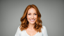 Young Mature Smiling Woman Portrait With Red Hair And White Top. Isolated On Grey Background. Copy Space. Generative AI