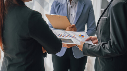 Wall Mural - Team of lawyers and tax auditors brainstorming together and calculating the balance sheet and historical financial accounts of the company and shareholders. to detect mistakes and prevent bribery