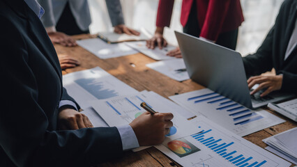 Wall Mural - Team of lawyers and tax auditors brainstorming together and calculating the balance sheet and historical financial accounts of the company and shareholders. to detect mistakes and prevent bribery