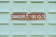 A sign with the inscription danger 11000 volts