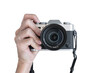 © korkeng - Hand holding vintage camera shooting front view isolated on transparent background