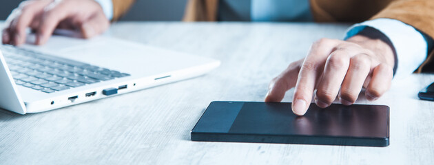 Poster - man hand tablet with keyboardon desk