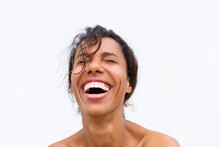 Beauty Portrait Of Young Topless African American Woman With Bare Shoulders On White Background With Perfect Skin And Natural Makeup Positive Laughing