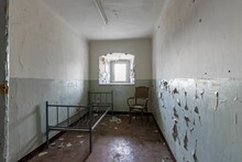 Interior Of A Delipidated Prison Cell In The Former German Democratic Republic